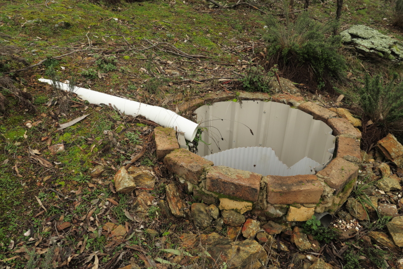 The old septic tank. It's missing its lid, has be concreted in, but there is enough still there to use it for short term use. It did originally seep out through the ground.